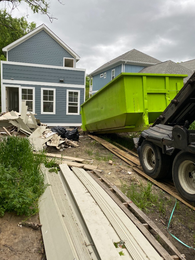 Dumpster delivery at job site