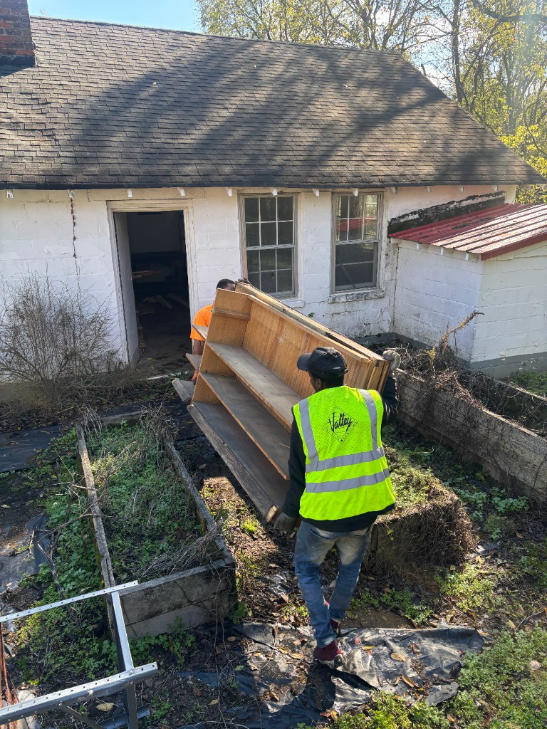 Crew removing furniture from building